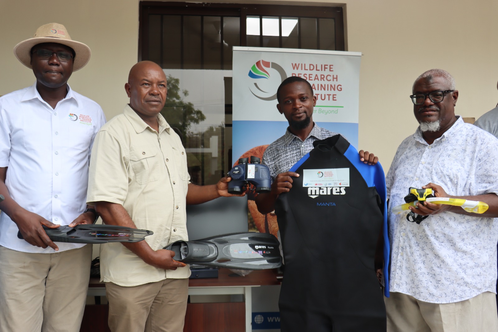 Dr David Nkedianye, Chair of the Board, WRTI receives marine research and conferencing equipment from ReSea project team