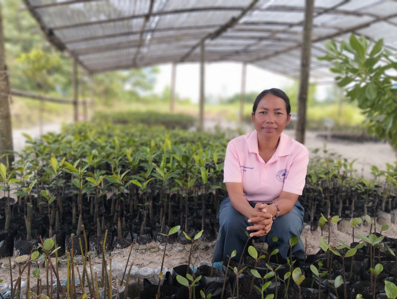 Women sitting in front of a nursery garden